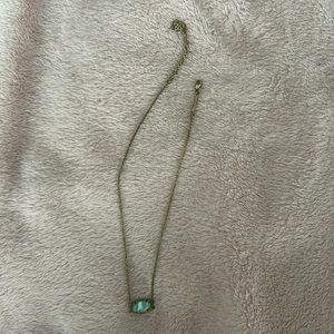 used gold and blue kendra scott necklace